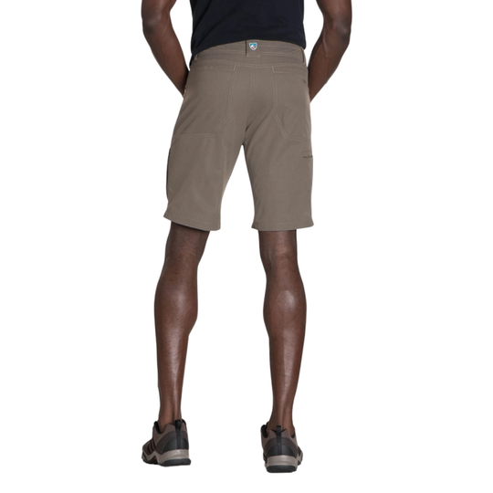 Person wearing beige shorts on a white background