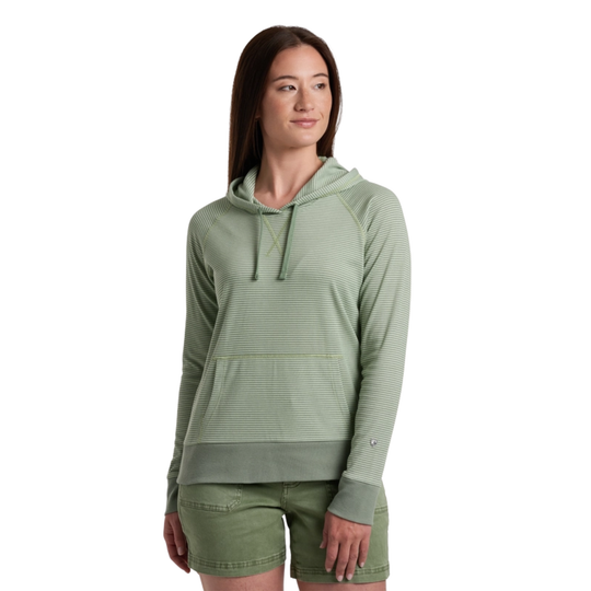 Woman wearing a green hoodie and shorts on a white background