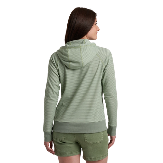Woman wearing a green hoodie and shorts on a white background