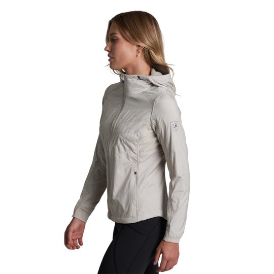Woman wearing a light gray jacket on a white background
