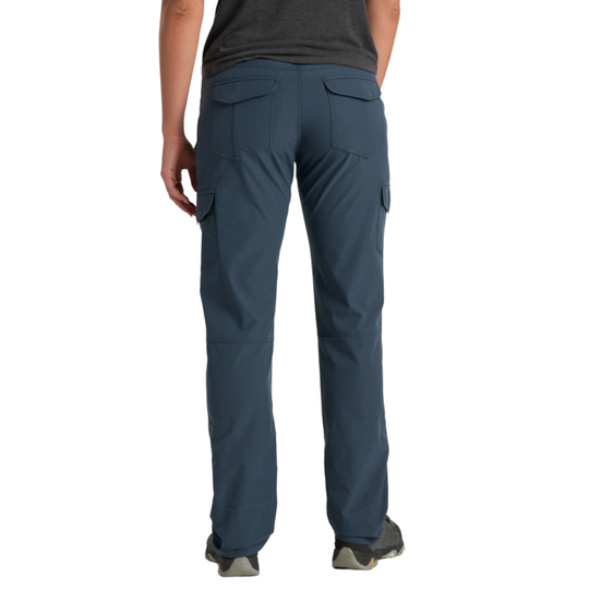 Person wearing blue cargo pants on a white background