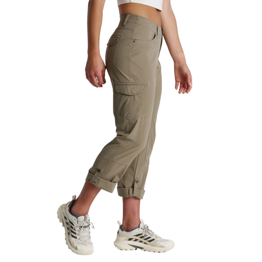 Person wearing beige cargo pants and white sneakers on a white background