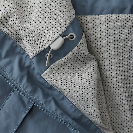 Close-up of a jacket with a zipper and mesh lining.
