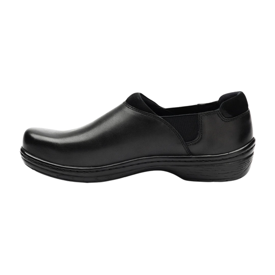 Black slip-on shoe on a white background