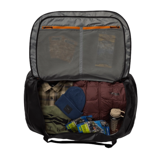 Open backpack with items inside on a white background