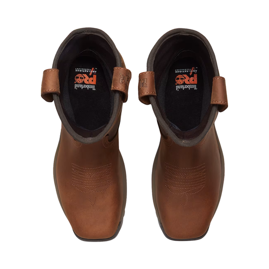 Pair of brown leather boots with a visible brand logo on a white background
