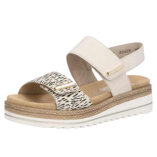 Beige sandal with a patterned strap on a white background