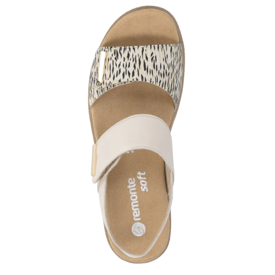 Tan sandal with animal print strap on a white background