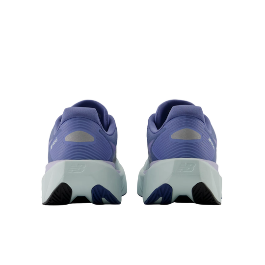 Purple running shoes with white soles on a white background