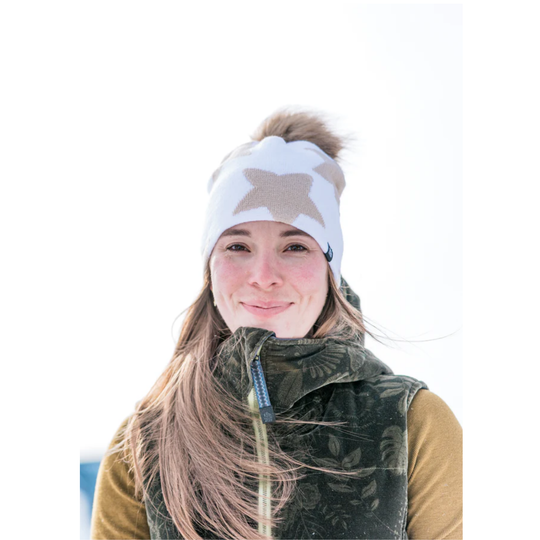 Person wearing a white hat with a star design on a white background