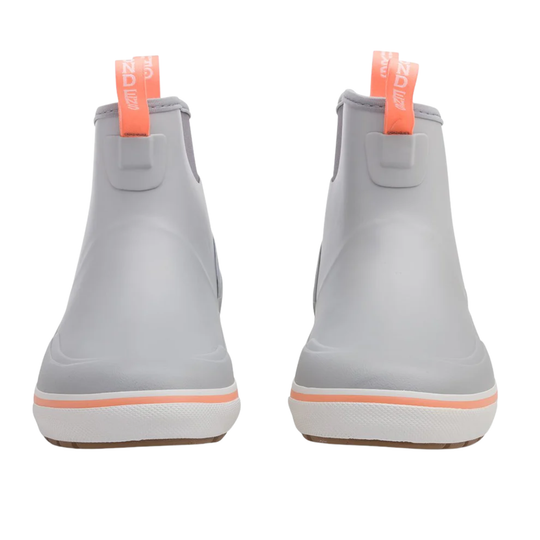 Pair of gray rain boots with orange accents on a white background