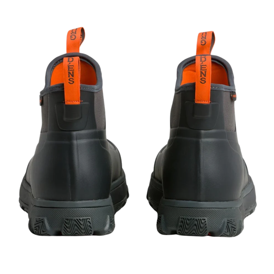 Black rubber boots with orange pull tabs on a white background