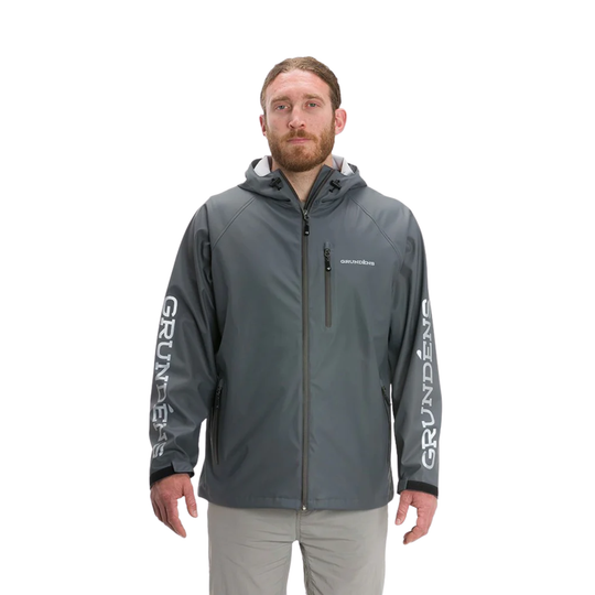 Man wearing a gray jacket with 'Grundéns' branding on a white background
