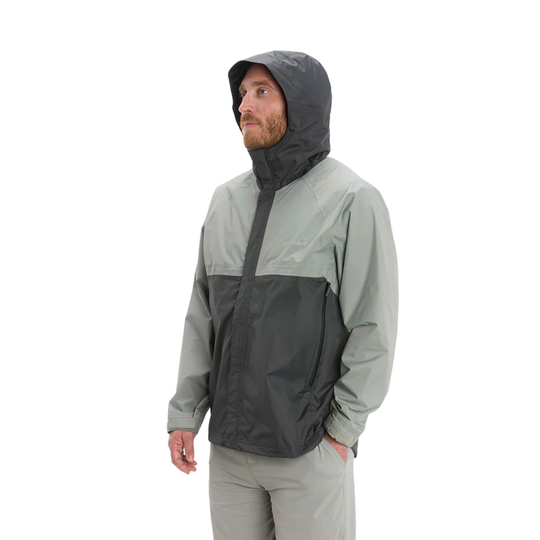 Person wearing a two-tone rain jacket with a hood on a white background