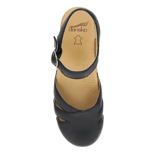 Black sandal with 'Dansko' branding on a white background