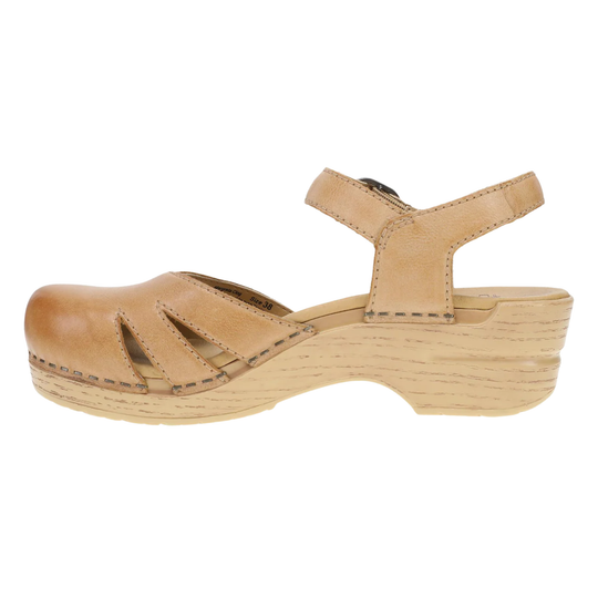 Tan clog shoe on a white background