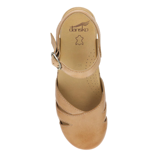 Tan sandal with 'Dansko' logo on a white background