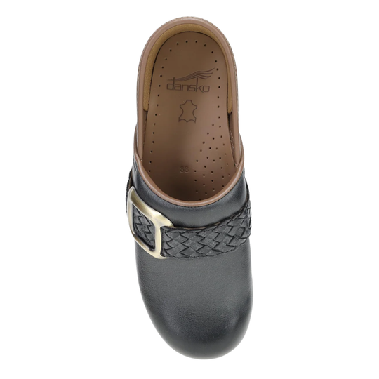 Black clog shoe with woven strap and gold buckle on a white background
