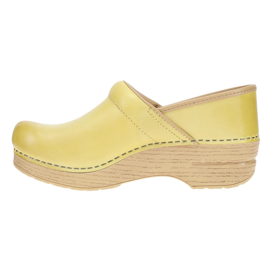 Yellow clog shoe on a white background