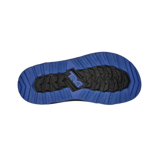 Blue sole of a shoe with black tread pattern on a white background