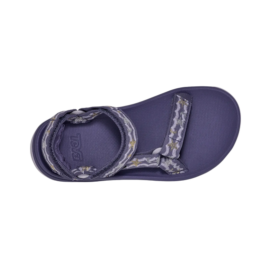 Purple sandal with decorative straps on a white background