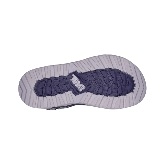 Bottom view of a shoe with a visible brand logo on a white background