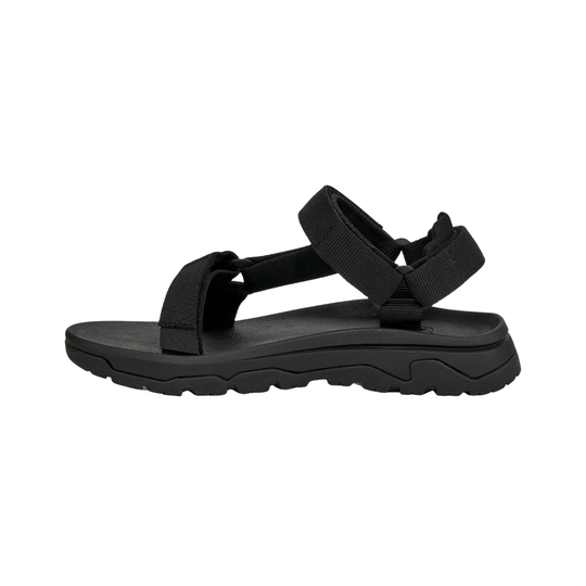 Black sandal with thick sole on a white background