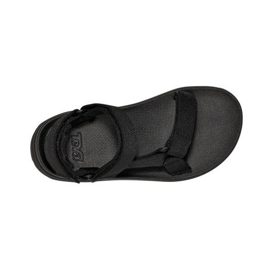 Black sandal with a strap on a white background