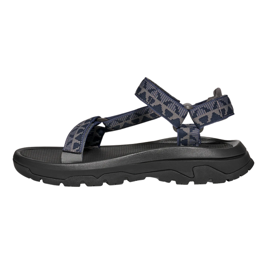 black sandal with multiple straps on a white background