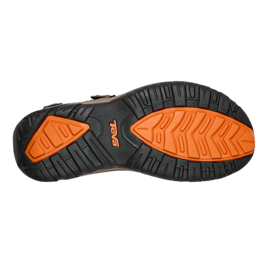 Black and orange sole of a shoe on a white background