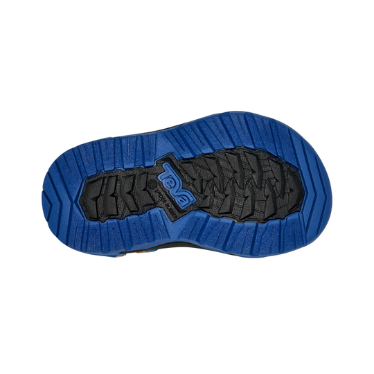 Blue and black sole of a shoe with brand logo on a white background