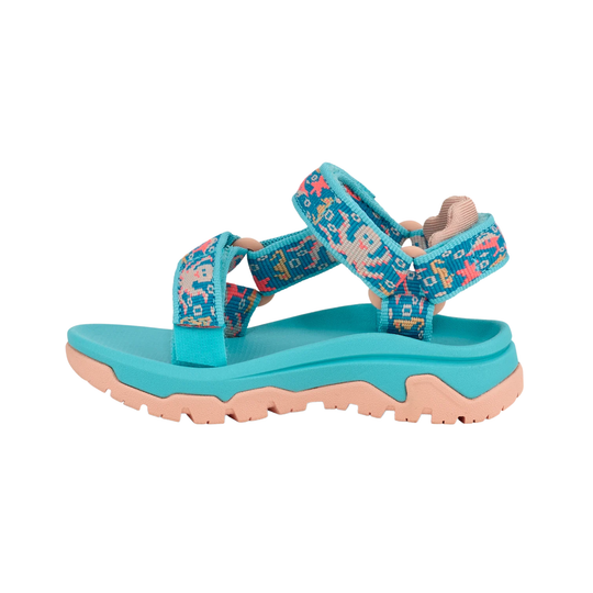 Turquoise sandal with pink sole on a white background