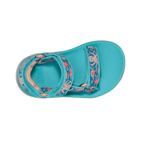 Turquoise sandal with floral pattern on a white background