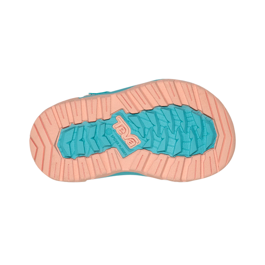 Close-up of a shoe sole with a brand logo on a white background