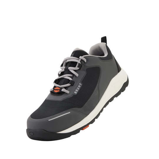 Gray athletic shoe with white sole on a white background