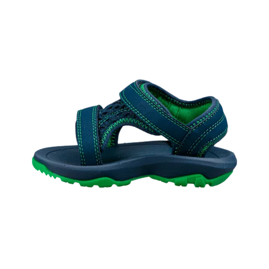 Navy blue sandal with green accents on a white background