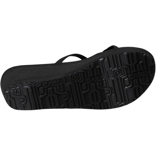 Black sandal with textured sole on a white background