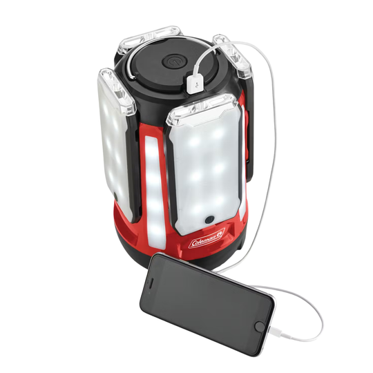 Red and black camping lantern with USB cable connected to a smartphone on a white background