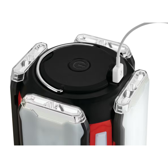 Close-up of a black electronic device with red accents on a white background