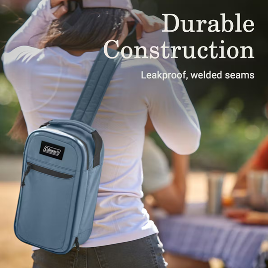 Blue soft-sided crossbody cooler bag with front zipper pocket and shoulder strap