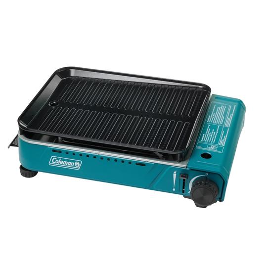 Teal Coleman portable grill on a white background