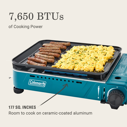 Coleman portable stove with food on a white background