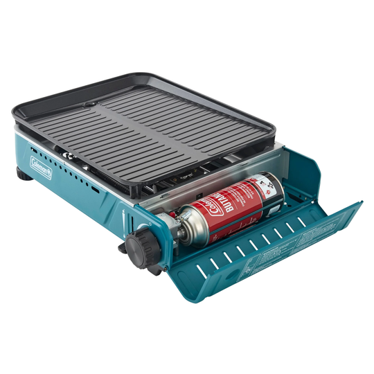 Portable grill with a Coleman brand logo on a white background