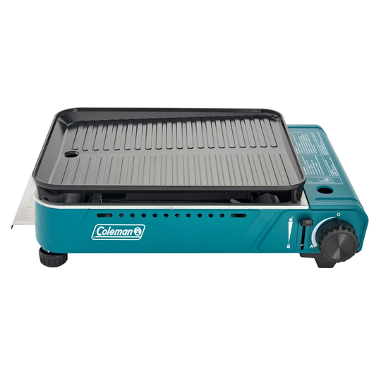 Blue Coleman portable grill on a white background