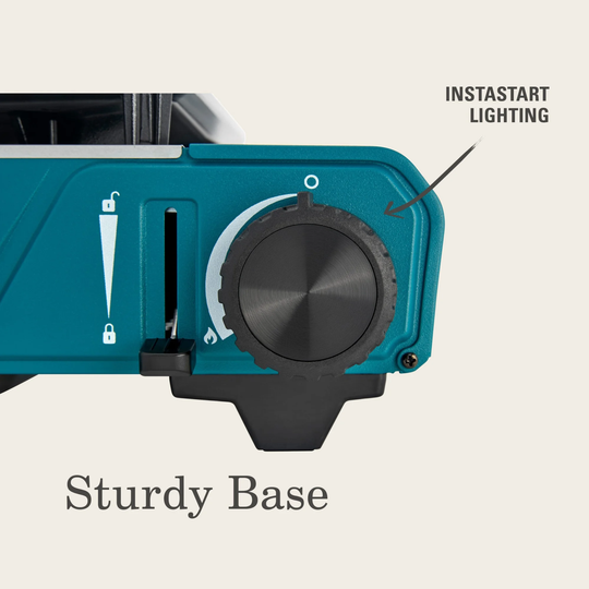 Teal camping stove with 'InstaStart Lighting' feature on a light gray background