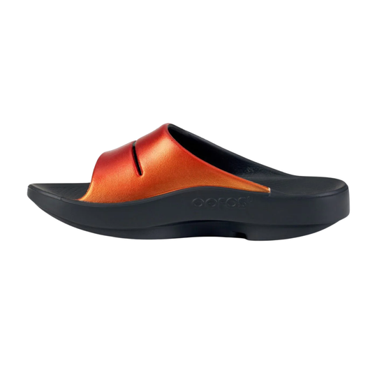 Black slide sandal with metallic orange upper and thick platform sole