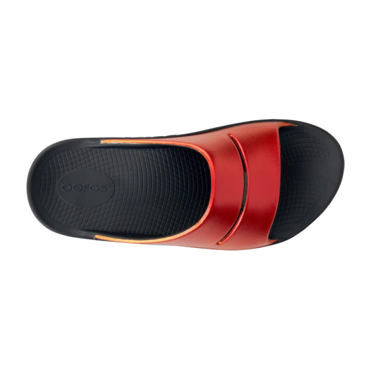 Red and black slide sandal on a white background