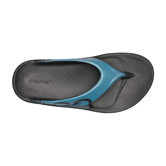 Black flip-flop sandal with a blue strap and textured footbed, shown from above
