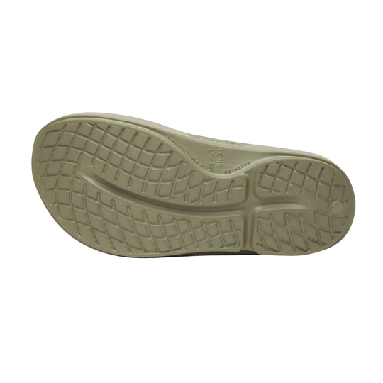 Close-up of a beige shoe sole on a white background