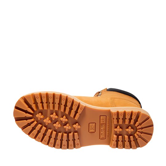 Close-up of a boot sole with a brand logo on a white background